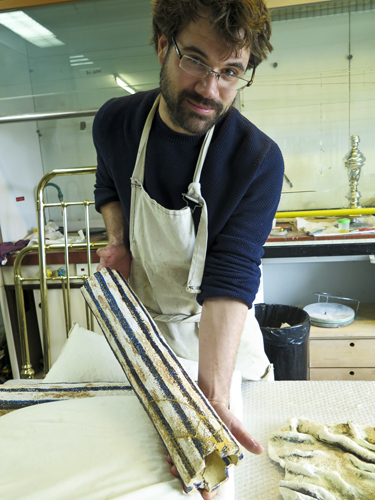 man showing ceramic tube