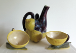 ceramic teapot of cast lemons, 2 half lemons as teacups
